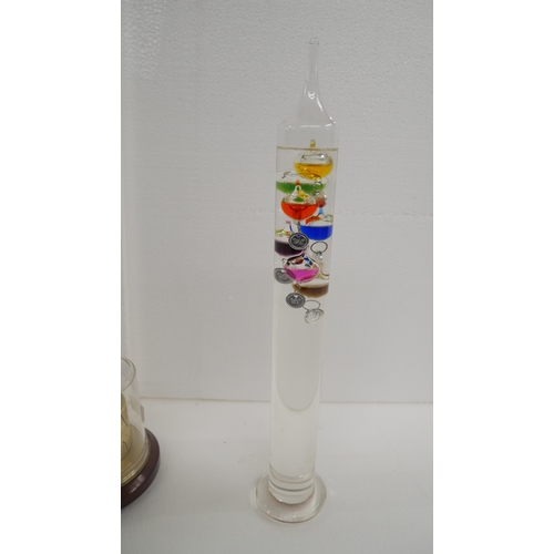 2204 - A Barigo weather station together with a Galileo thermometer
