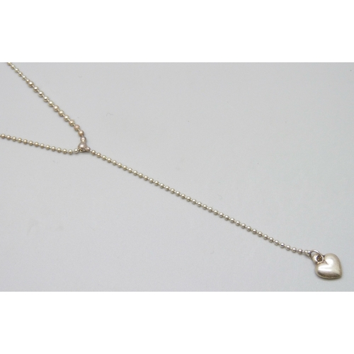 7070 - An Italian silver necklace with a heart drop pendant and ball chain, 45.5cm full extension