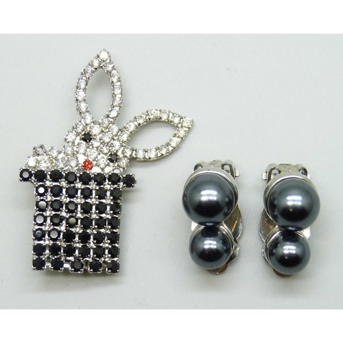 7072 - A Butler and Wilson brooch, 4.3cm, and a pair of Butler & Wilson faux pearl earrings