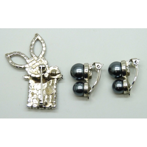 7072 - A Butler and Wilson brooch, 4.3cm, and a pair of Butler & Wilson faux pearl earrings