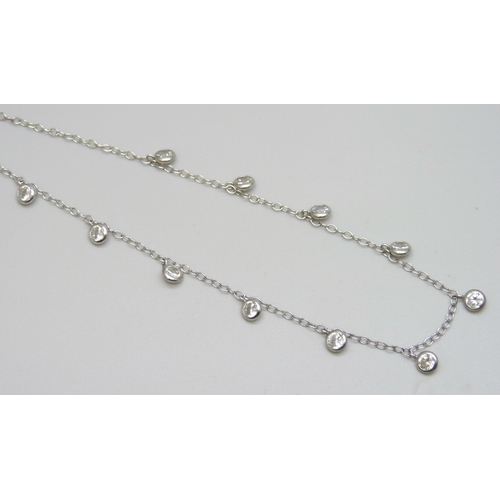 7097 - A silver fringe style necklace set with cubic zirconia stones, 49.5cm full extension