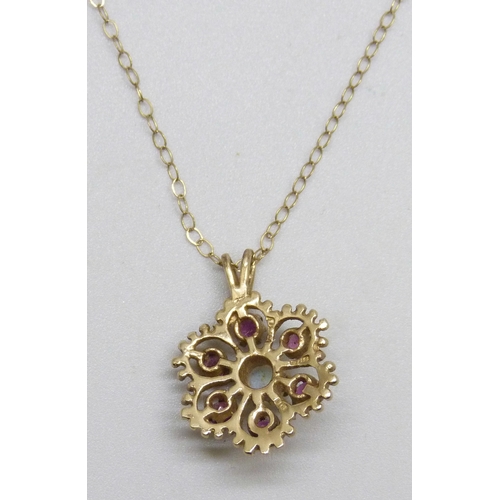 7119 - A 9ct gold, ruby an opal cluster pendant, 2cm including bail, on a 9ct gold chain, 2.2g total