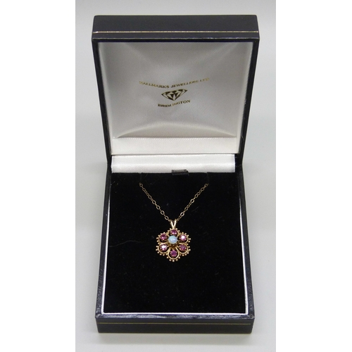 7119 - A 9ct gold, ruby an opal cluster pendant, 2cm including bail, on a 9ct gold chain, 2.2g total