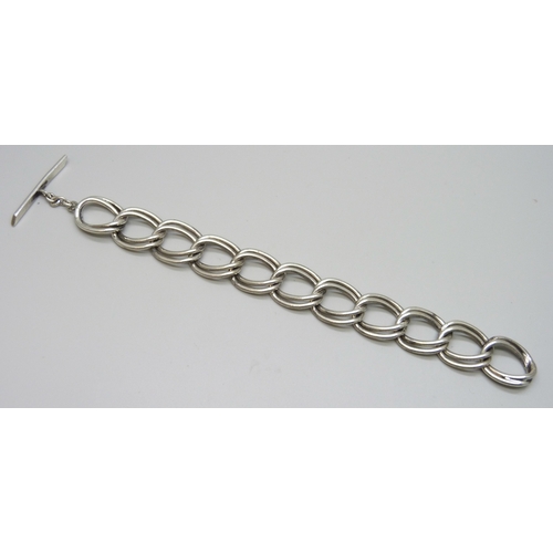 7132 - A silver chunky link bracelet, 50g, 21cm, 1.8cm wide links