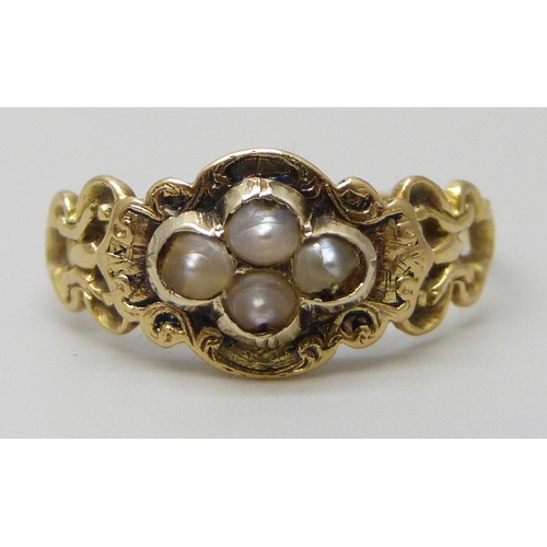 7144 - A Victorian yellow metal mourning ring set with seed pearls, with memorial inscription dated 1854, m... 