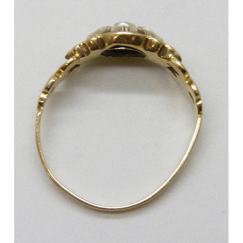 7144 - A Victorian yellow metal mourning ring set with seed pearls, with memorial inscription dated 1854, m... 