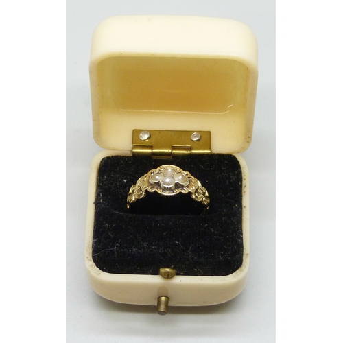 7144 - A Victorian yellow metal mourning ring set with seed pearls, with memorial inscription dated 1854, m... 