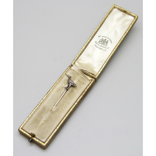 7145 - A yellow metal diamond set stick pin in the form of a bird set with a sapphire eye, length altered, ... 