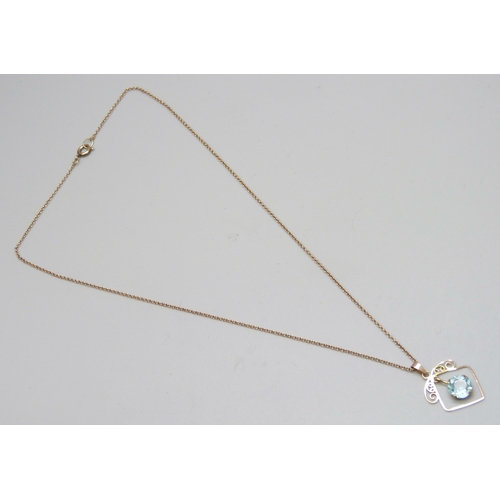 7150 - An early 20th Century yellow metal blue paste stone set pendant, 2.4cm, on a 9ct gold chain, 2.5g to... 