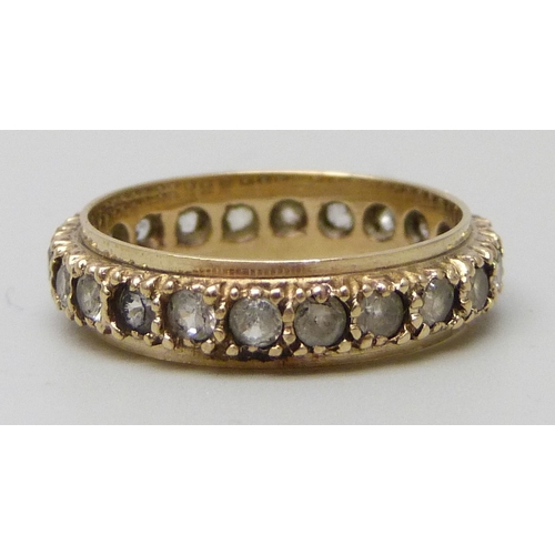 7153 - A 9ct gold full eternity ring set with synthetic spinel, 2.4g, L