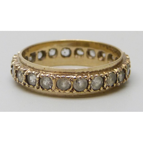 7153 - A 9ct gold full eternity ring set with synthetic spinel, 2.4g, L