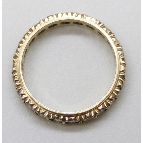 7153 - A 9ct gold full eternity ring set with synthetic spinel, 2.4g, L