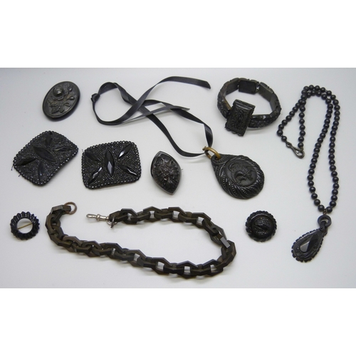 7160 - A collection of Whitby Jet and bog oak including a chain, and a pair of French jet buckles