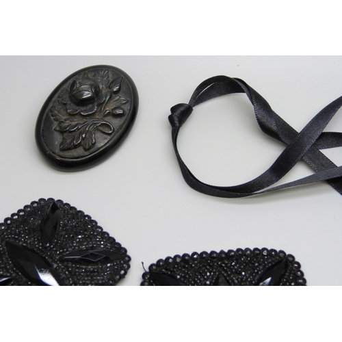 7160 - A collection of Whitby Jet and bog oak including a chain, and a pair of French jet buckles