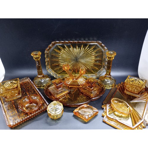 2150 - Large collection of Art Deco amber glass comprising of dressing table sets, trays, pots, candlestick... 