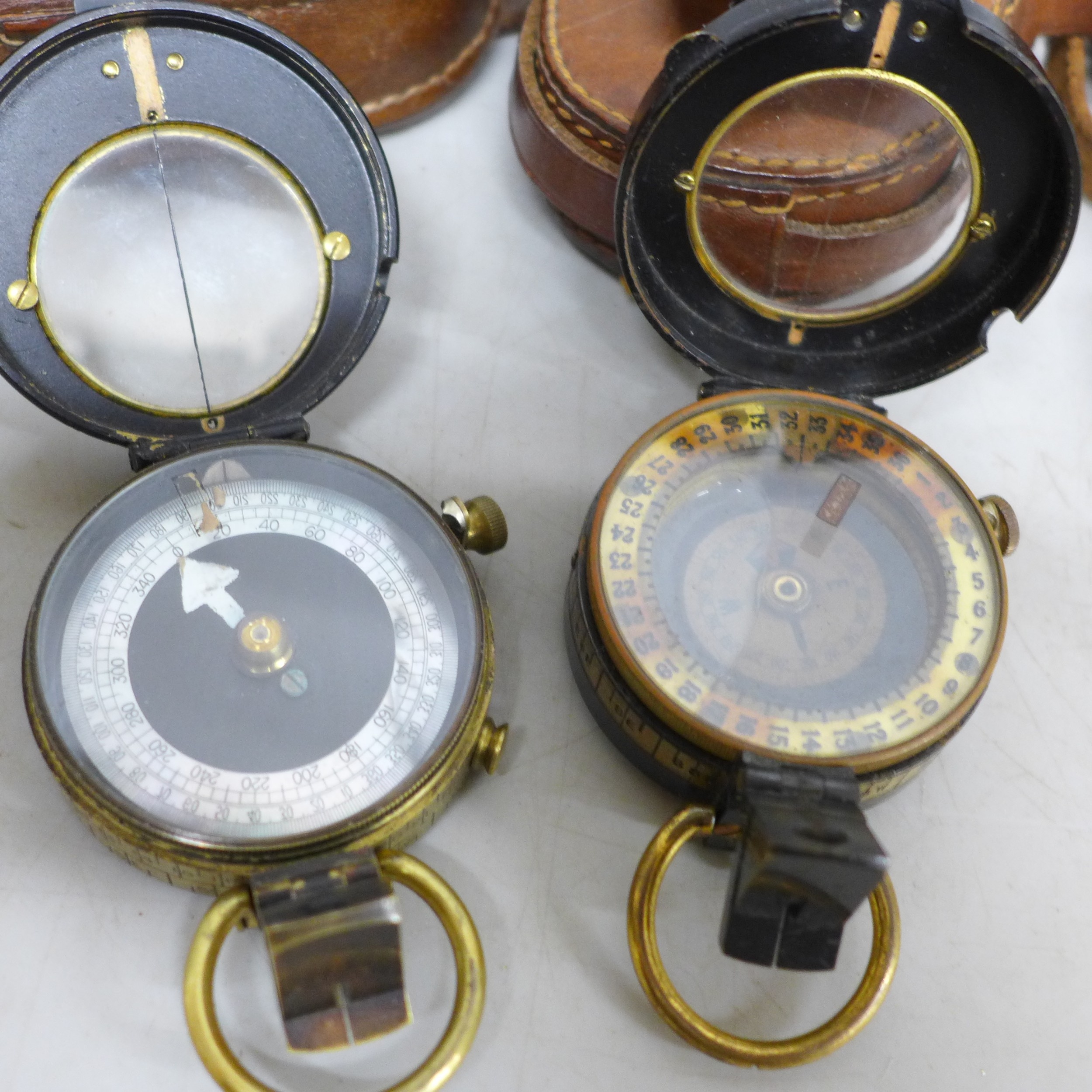 A Hugh Rees Ltd. compass, with leather case and one other