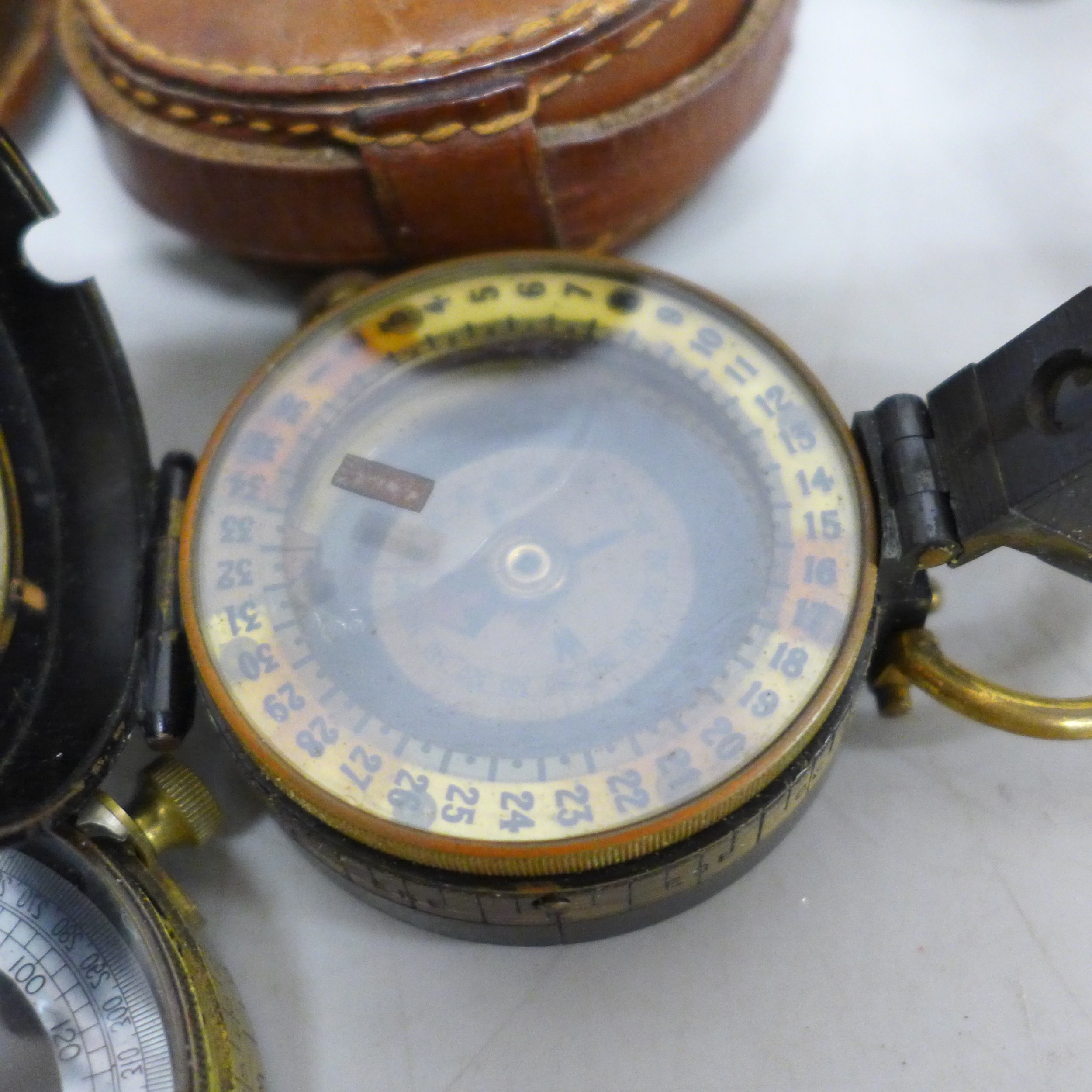 A Hugh Rees Ltd. compass, with leather case and one other