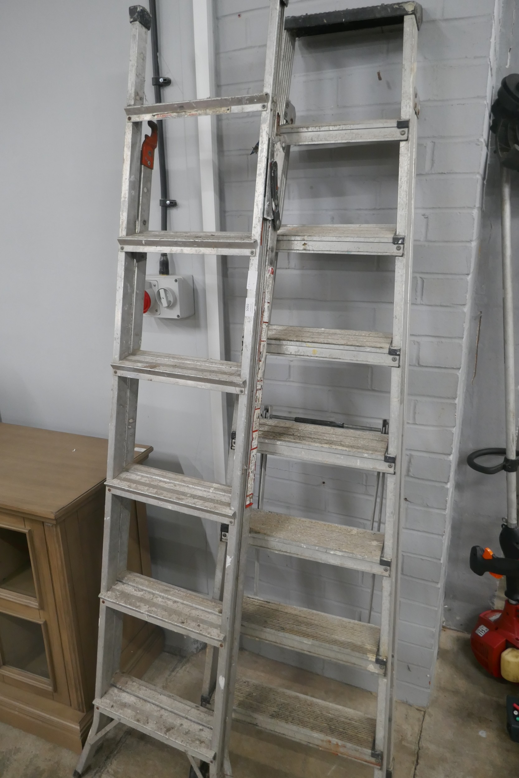 Three aluminium stepladders