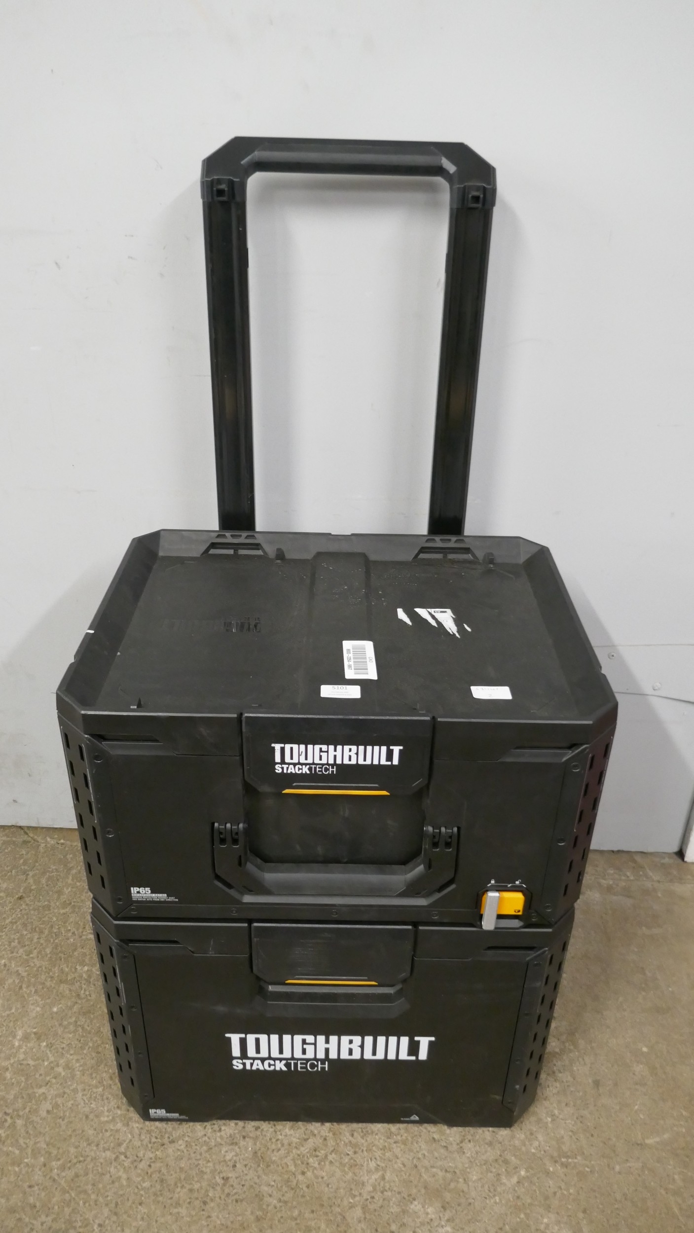 A Toughbuilt stack tech black 2 wheeled tool box *This lot is subject ...