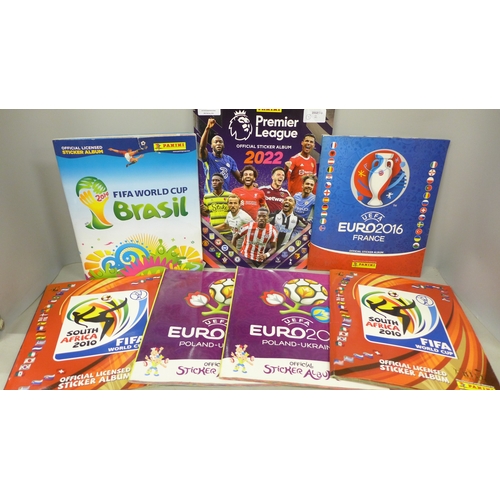 2073 - A collection of Panini Football sticker albums,  comprising two South Africa 2010, two Euro Poland-U... 