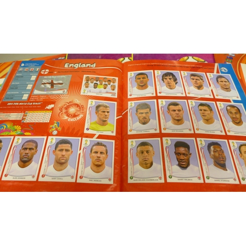 2073 - A collection of Panini Football sticker albums,  comprising two South Africa 2010, two Euro Poland-U... 