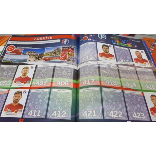 2073 - A collection of Panini Football sticker albums,  comprising two South Africa 2010, two Euro Poland-U... 