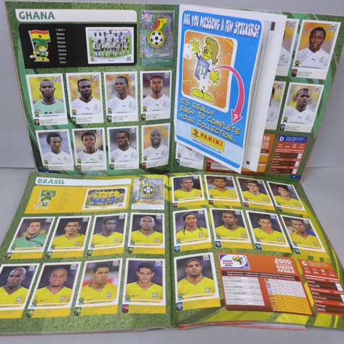 2073 - A collection of Panini Football sticker albums,  comprising two South Africa 2010, two Euro Poland-U... 
