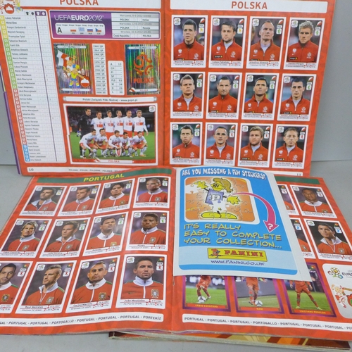2073 - A collection of Panini Football sticker albums,  comprising two South Africa 2010, two Euro Poland-U... 