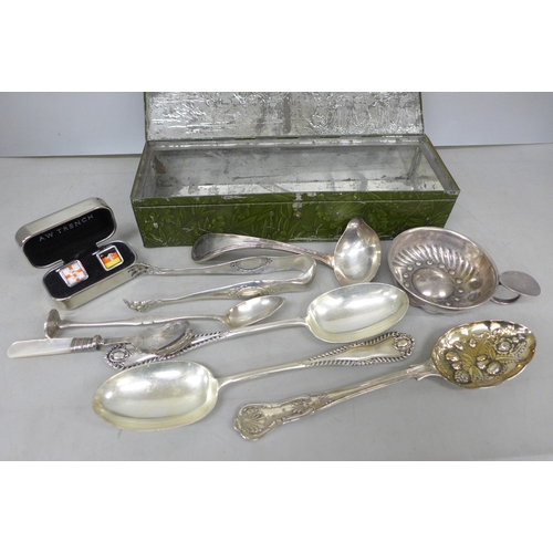 2080 - A Huntley and Palmer biscuit tin, a white metal spoon and ice nips, and some plated flatware