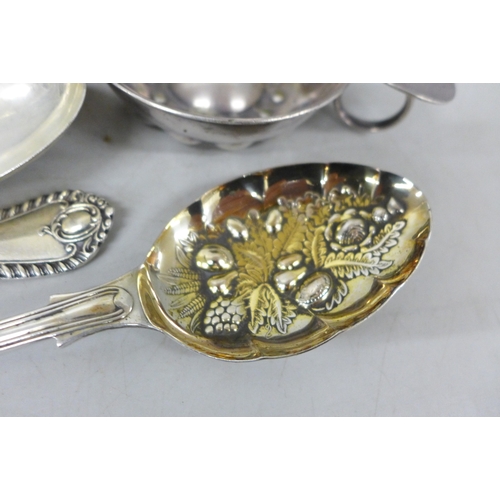 2080 - A Huntley and Palmer biscuit tin, a white metal spoon and ice nips, and some plated flatware