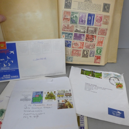 2083 - Stamps; a collection of stamps in an album and loose, 20th century