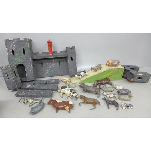 2088 - A collection of cold painted farmyard animals and a model fort, possibly Triang