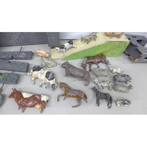 2088 - A collection of cold painted farmyard animals and a model fort, possibly Triang