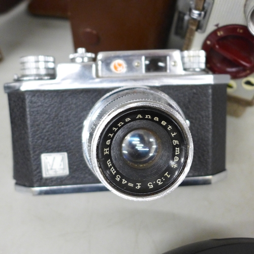 2089 - A collection of cameras including Halina-Prefect, a Bell and Howell 8mm camera, an Agfa Moviematic C... 