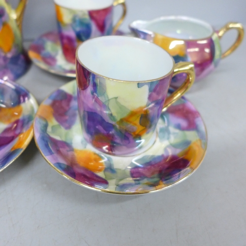 2099 - A Czechoslovakian porcelain six setting coffee service, fifteen pieces in total, one cup chipped