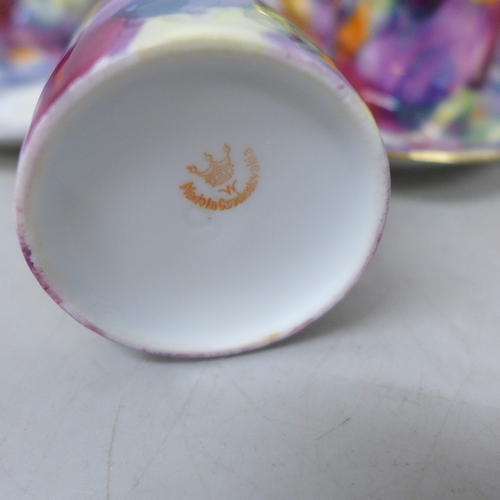 2099 - A Czechoslovakian porcelain six setting coffee service, fifteen pieces in total, one cup chipped