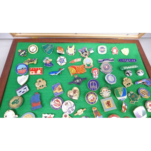 2100 - A collection of enamel badges, etc., including Butlin’s, mounted