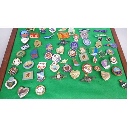 2100 - A collection of enamel badges, etc., including Butlin’s, mounted