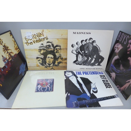 2103 - Nine LP records including Bob Marley, Madness, The Eagles, Paul Simon, Survivor, etc.