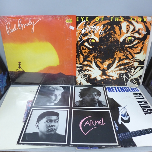 2103 - Nine LP records including Bob Marley, Madness, The Eagles, Paul Simon, Survivor, etc.