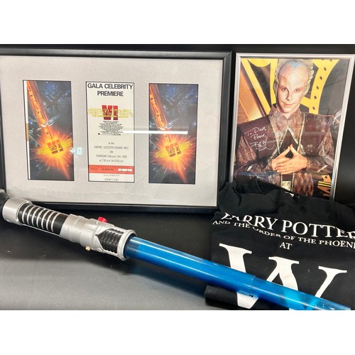 2131 - A Star Wars light sabre, boxed, a model USS Enterprise, a framed Gala Celebrity Premier ticket, a Ba... 