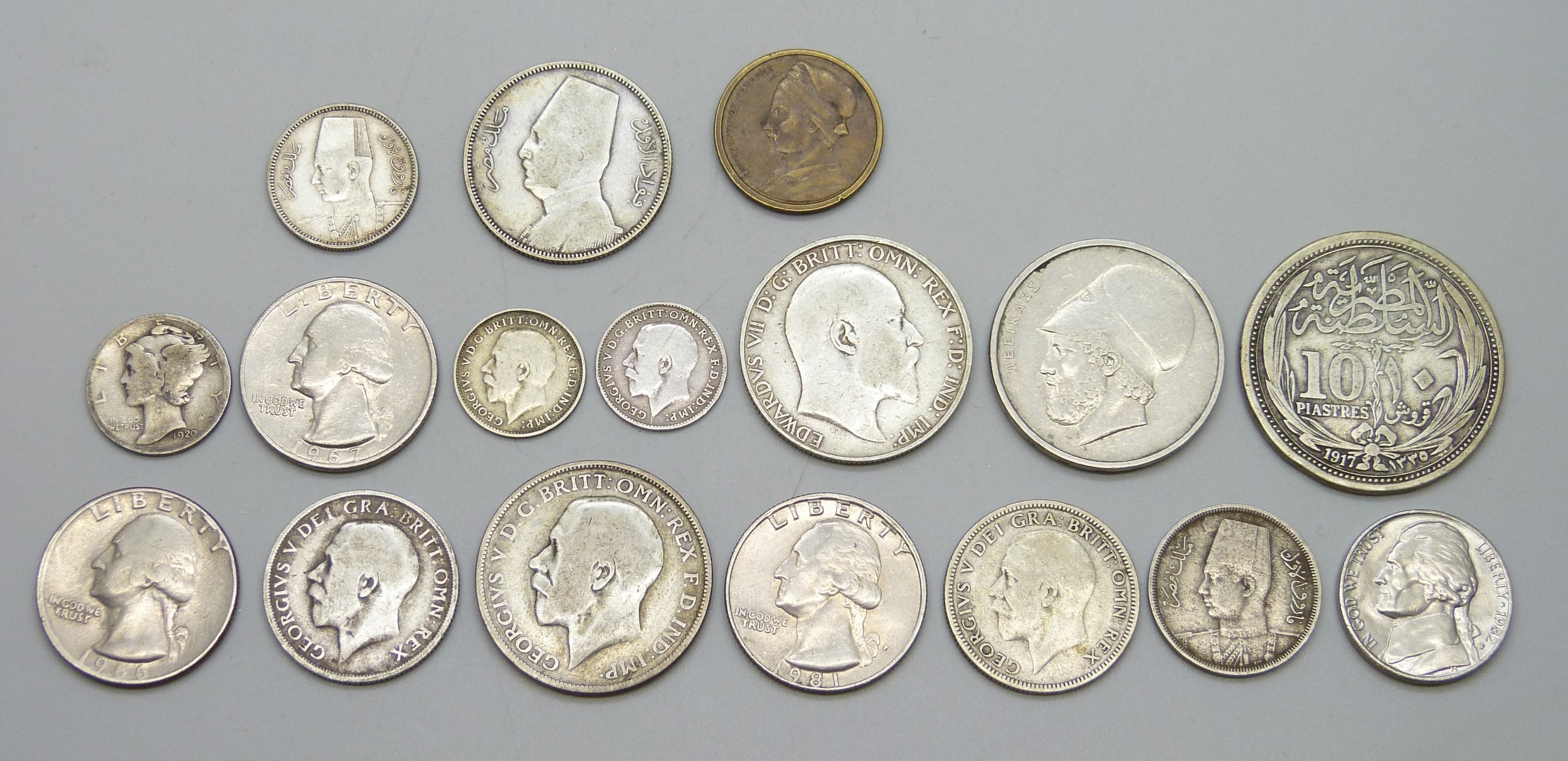 A collection of coins including silver examples