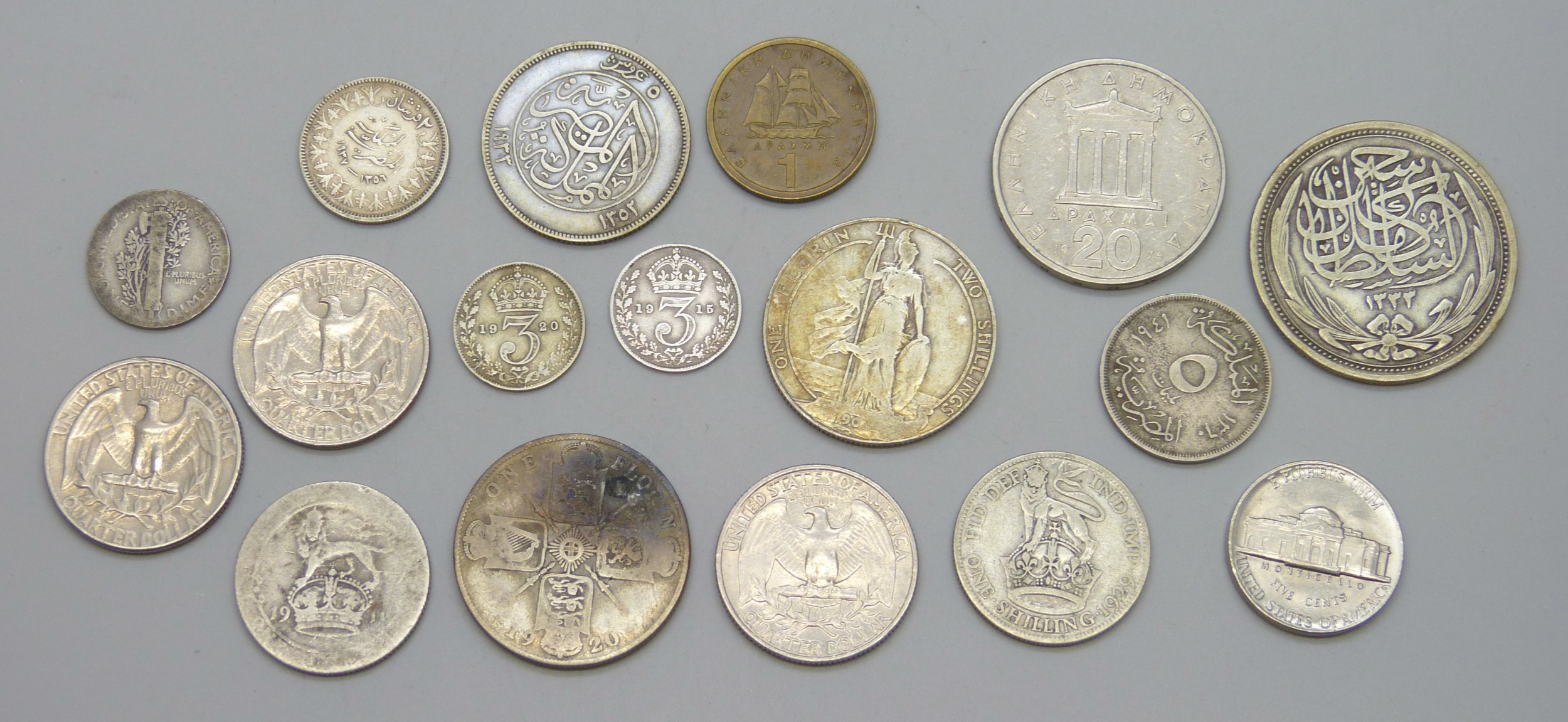 A collection of coins including silver examples
