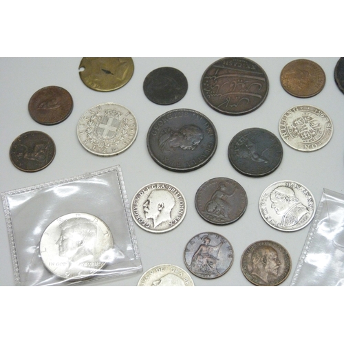 A collection of coins including silver examples