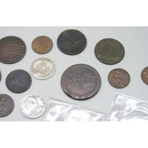 A collection of coins including silver examples