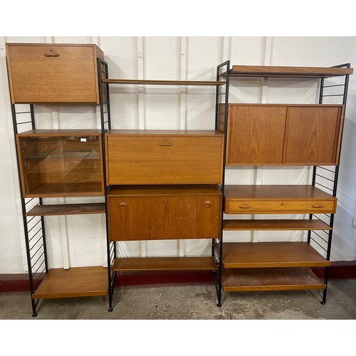 28 - A Staples teak and black tubular metal Ladderax four bay room divider, designed by Robert Heal