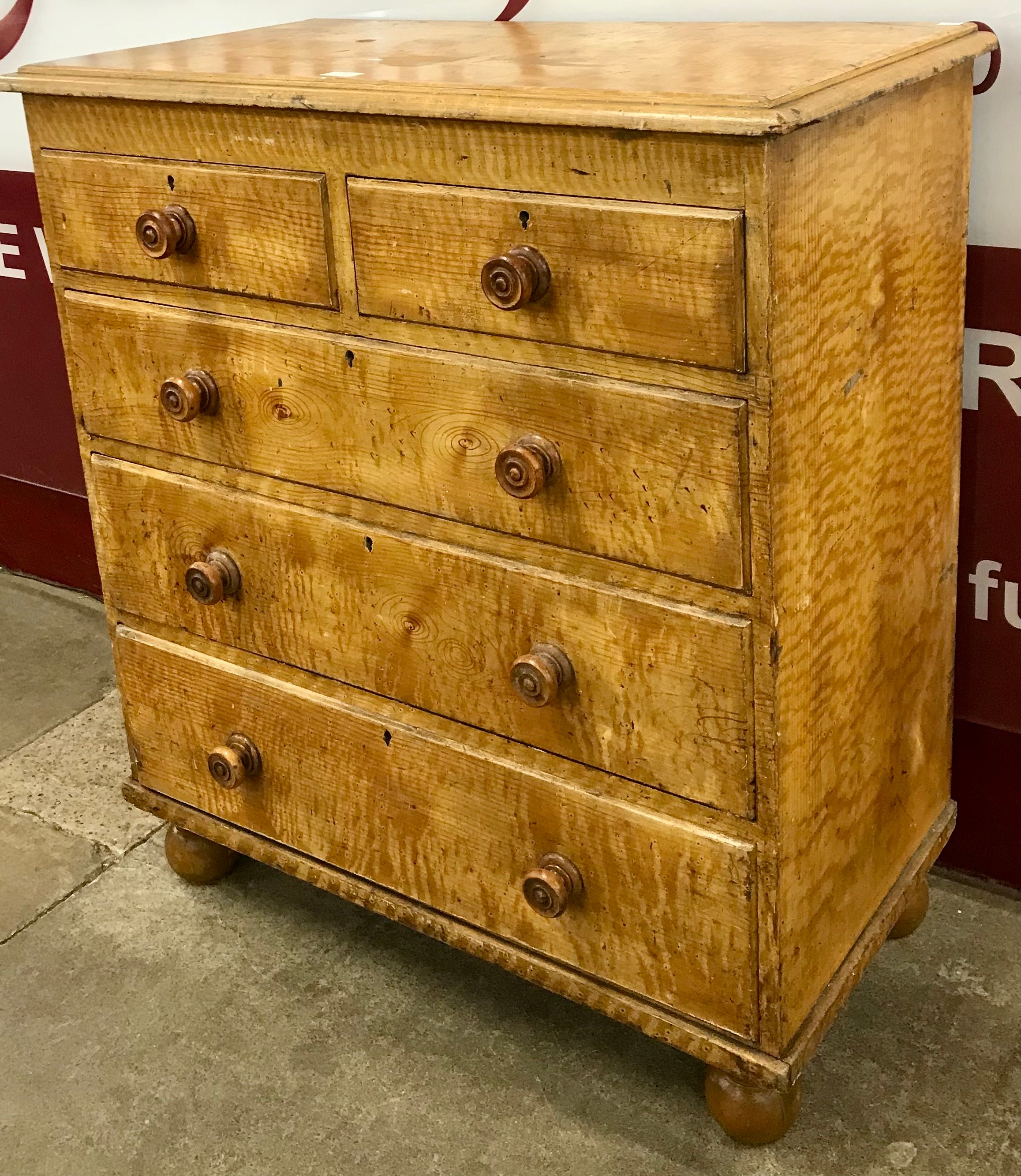 A Victorian scumbled pine chest of drawers