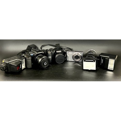 2144 - A collection of cameras including Fuji film Fine Pix and Dimage A200