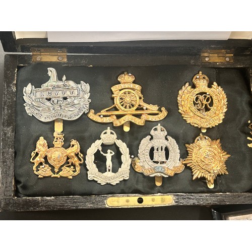 2127 - A collection of trench art, a case with seven military badges, etc.