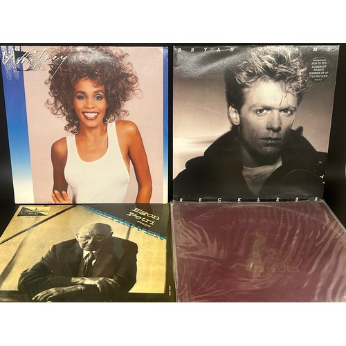 2135 - Approximately 75 pop and rock LP records, also a vintage case, Paul McCartney, UB40, etc.